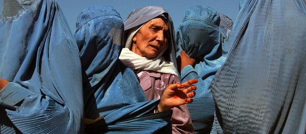 Afghan Women Queue at World Food Programme Distribution Point